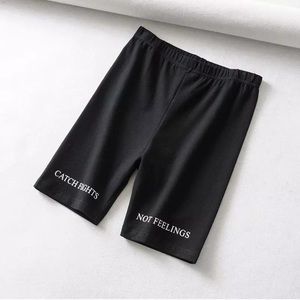 “Catch flights, not feelings” black biker shorts